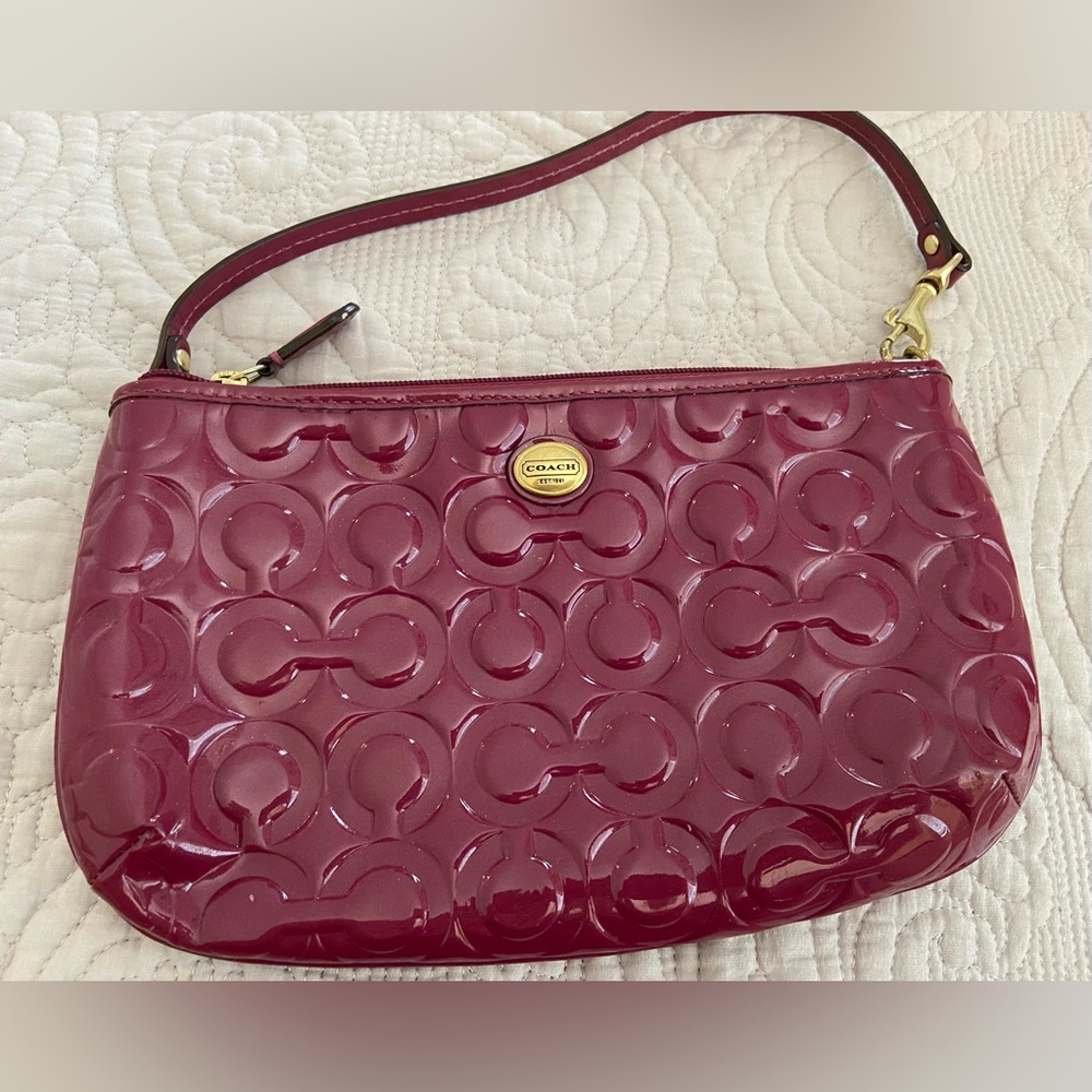 Coach Peyton embossed leather small handbag - never used. Color is Passion Berry